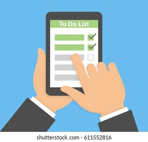Hand holding and pointing to a tablet with to do list on the display
