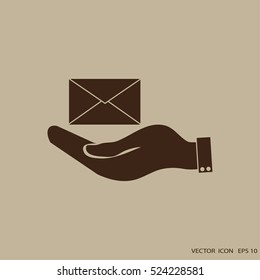 hand holding a postal envelope