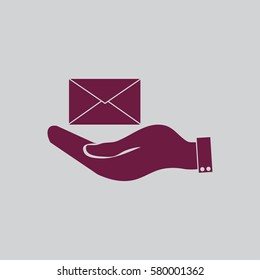 hand holding a postal envelope
