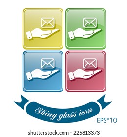 hand holding a postal envelope sign. e-mail symbol . icon envelope.