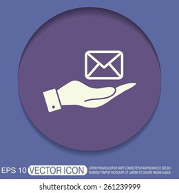 hand holding a postal envelope sign. e-mail symbol . icon envelope.
