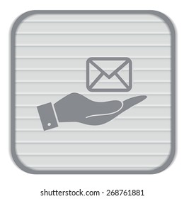 hand holding a postal envelope sign. e-mail symbol . icon envelope.