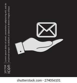 Hand holding a postal envelope sign. E-mail symbol. Icon envelope.