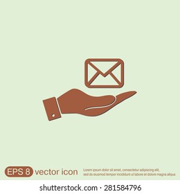 hand holding a postal envelope sign. e-mail symbol . icon envelope.