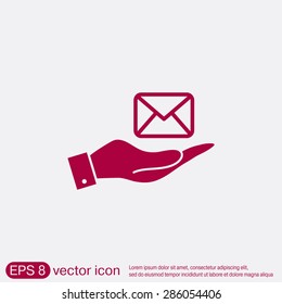 hand holding a postal envelope sign. e-mail symbol . icon envelope.