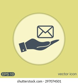 hand holding a postal envelope sign. e-mail symbol . icon envelope.