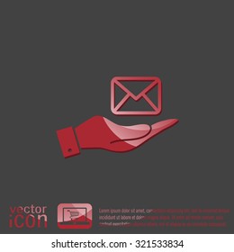 hand holding a postal envelope sign. e-mail symbol . icon envelope.