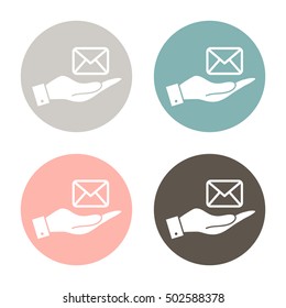 hand holding a postal envelope sign. e-mail symbol . icon envelope.