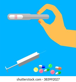 Hand - Holding Pregnancy Test Pack (Positive)
