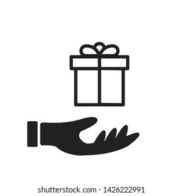 Hand holding present icon isolated. Giving christmas gifts icon. Isolated celebration symbol. EPS 10