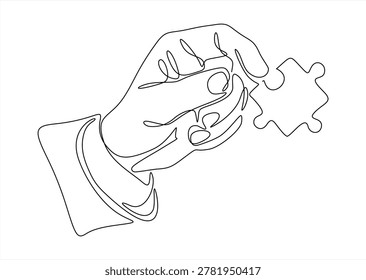 Hand holding puzzle piece