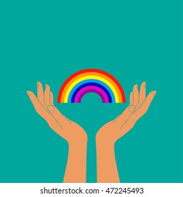 hand holding rainbow