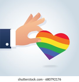 hand holding rainbow flag heart vector. Love is love, love wins. 