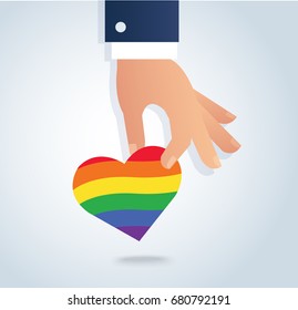 hand holding rainbow flag heart vector. Love is love, love wins. 