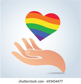 hand holding the rainbow flag in heart shape icon vector, 