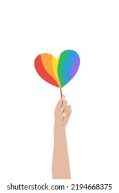 Hand Holding Rainbow Heart On White Background. Heart In Rainbow LGBT Flag Colors. Lesbian, Gay, Bisexual And Transgender Rights. Vector Illustration.