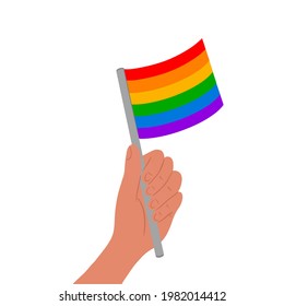 Hand holding rainbow lgbt flag isolated on white background