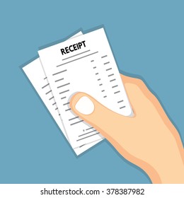 Hand holding receipt .
