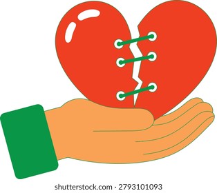 Hand holding a red broken heart mended with green laces