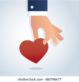 hand holding the red heart vector