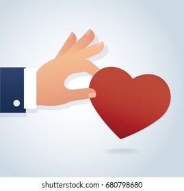 hand holding the red heart vector