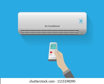 Hand holding remote control open the air conditioner is cooled to 25 degrees Celsius on blue background,Energy saving concept