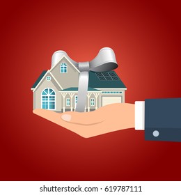 Hand holding residential building with the gray colored ribbon. Vector illustration. 