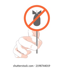 Hand holding road stop sign with bomb