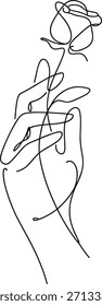 Hand holding a rose with a ring on the finger