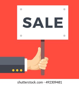 Hand holding sale placard. Commerce, Black Friday, shopping season, promotion concepts. Flat design elements for web sites, printed materials, web banner, infographics. Vector illustration