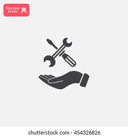 hand holding a screwdriver and wrench, symbol settings sign