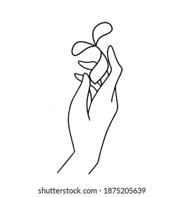 Hand holding a seed with leaves. Line drawing of back to nature theme. Growing plant in hand palm. Concept of growing and love earth hand drawn vector illustration.