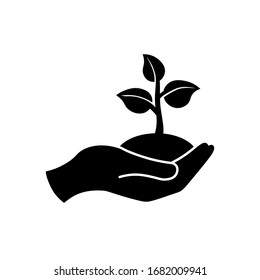 Hand holding seedlings with leaves or palm with sprout, ecology icon in black on an isolated white background. EPS 10 vector