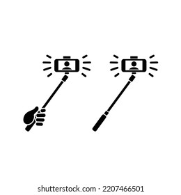 Hand Holding Selfie Stick Taking Picture Icon Vector Symbol.