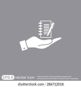 hand holding a sheet of paper and pen