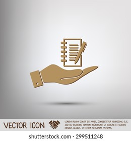 hand holding a sheet of paper and pen