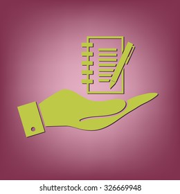 hand holding a sheet of paper and pen