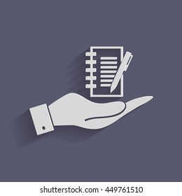 hand holding a sheet of paper and pen