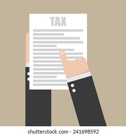 Hand holding a sheet of paper and text tax