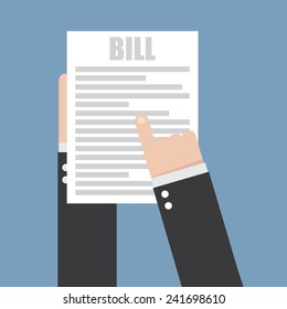 Hand holding a sheet of paper and text bill