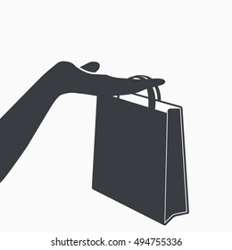 Hand holding shopping bag