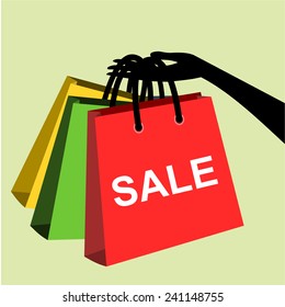 Hand holding shopping bags to promote sales.vector