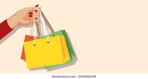 Hand holding shopping bags in vibrant colors. Vector illustration