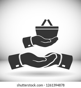 hand holding a shopping cart online store. icon. Vector Eps 10