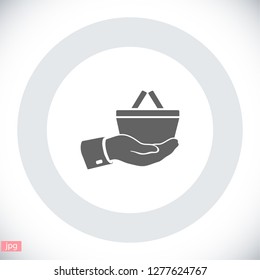 hand holding a shopping cart online store. icon. Vector Eps 10