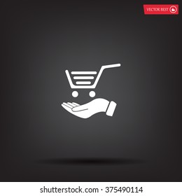 hand holding a shopping cart online store. icon. Vector Eps 10