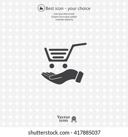 hand holding a shopping cart online store. icon. Vector Eps 10