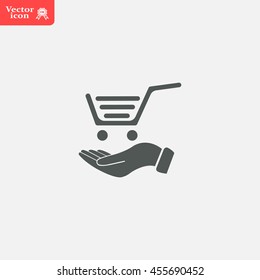 hand holding a shopping cart online store. icon. Vector Eps 10