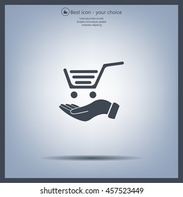 hand holding a shopping cart online store. icon. Vector Eps 10