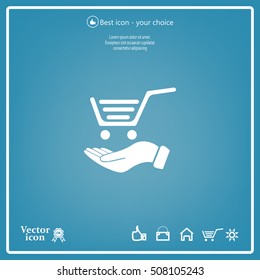 hand holding a shopping cart online store. icon. Vector Eps 10